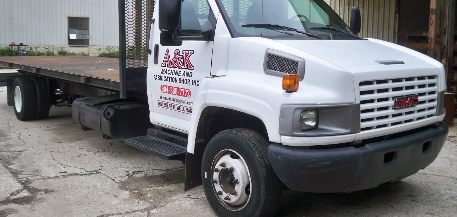 A&K service truck staged at a large processing plant at dawn — A&K Machine & Fabrication, Jacksonville FL