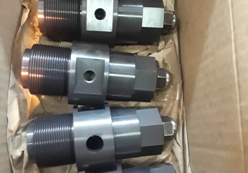 Box of large machined cylindrical parts (drive rollers/hubs) — A&K Machine & Fabrication, Jacksonville FL