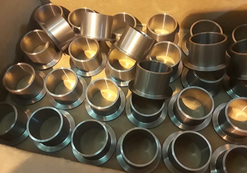 Bunch of small machined brass/bronze bushings - production — A&K Machine & Fabrication, Jacksonville FL