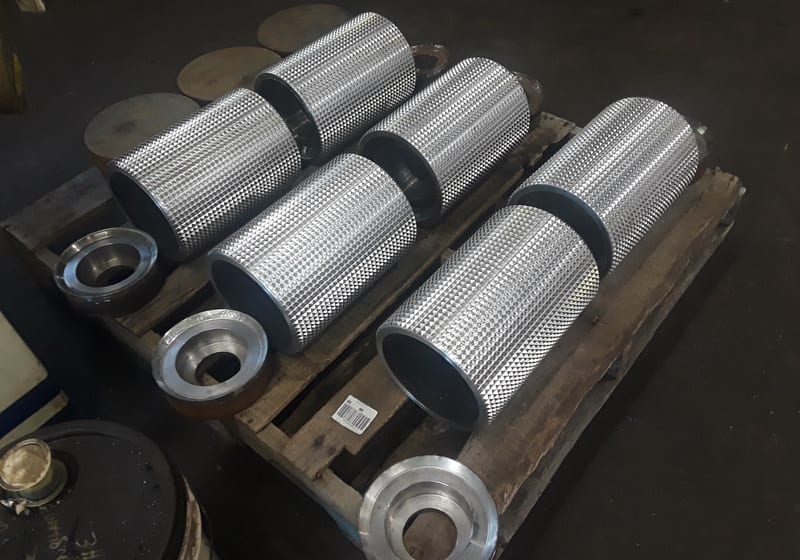 Row of stacked machined cylindrical hubs — A&K Machine & Fabrication, Jacksonville FL