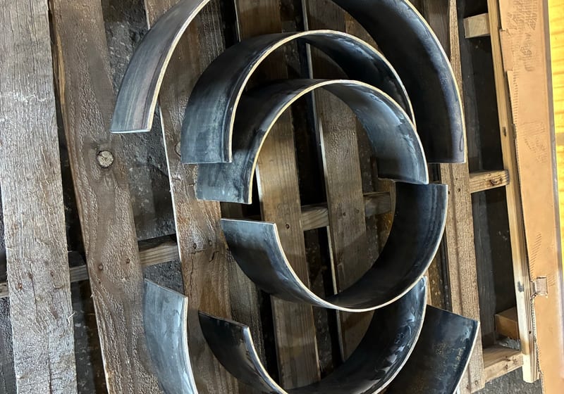 Large diameter rolled steel rings stacked - bulk fab — A&K Machine & Fabrication, Jacksonville FL