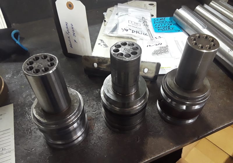 Close-up machined hex-pattern shafts in box — A&K Machine & Fabrication, Jacksonville FL