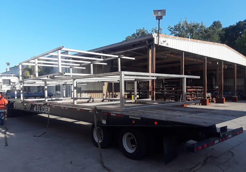 Long stainless fabrication outside shop on flatbed — A&K Machine & Fabrication, Jacksonville FL