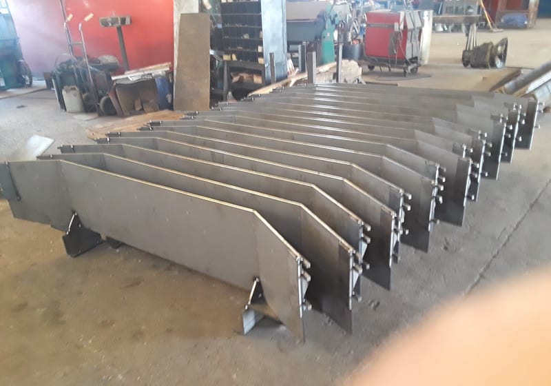 Rack of fabricated steel grates/screen sections — A&K Machine & Fabrication, Jacksonville FL