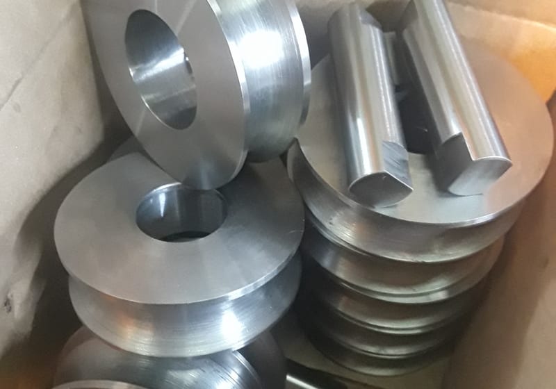 Stack of machined steel hubs/wheels — A&K Machine & Fabrication, Jacksonville FL