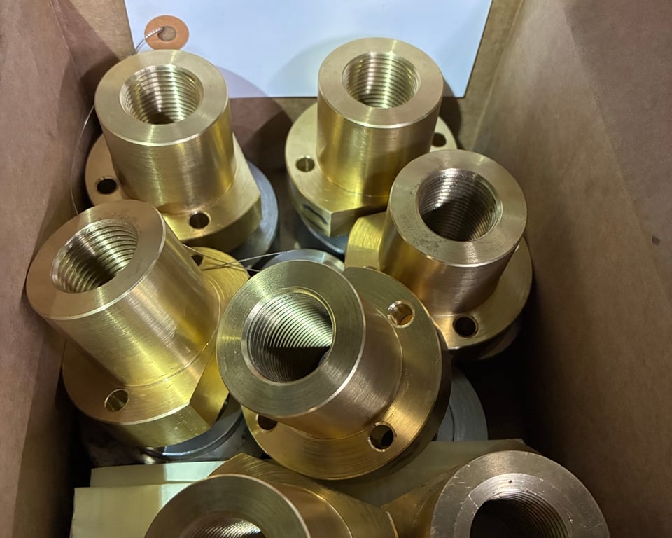 Bronze and brass bushings boxed and labeled ready for shipment — A&K Machine & Fabrication, Jacksonville FL