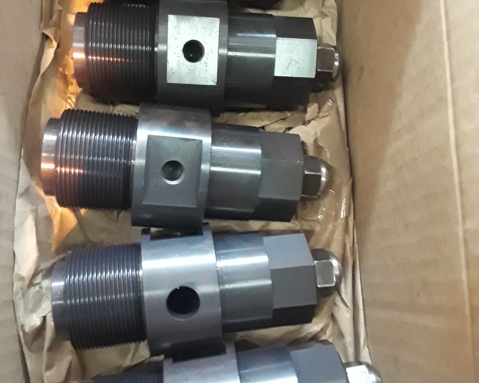 Boxed and labeled freshly-machined conveyor components staged for scheduled replacement — A&K Machine & Fabrication, Jacksonville FL