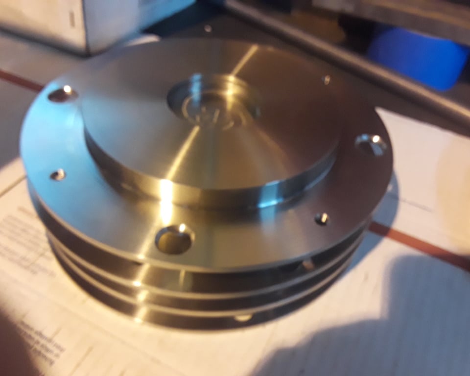 Bronze-coated sheave/pulley with concentric grooved surface — custom-machined pulley by A&K Machine & Fabrication, Jacksonville FL