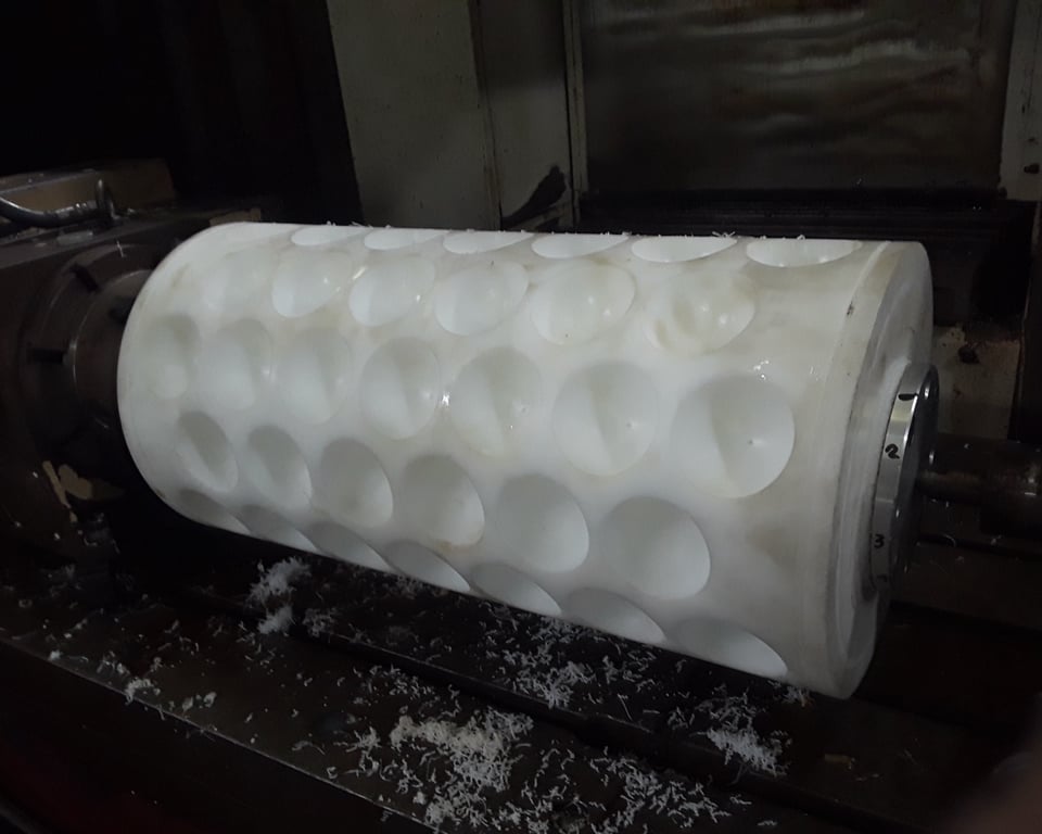 Machined white UHMW polyethylene cylinder — A&K Machine & Fabrication, Jacksonville FL